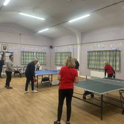 People playing table tennis