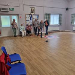 People playing Kurling
