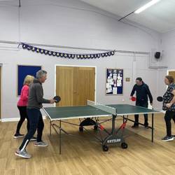 People playing table tennis