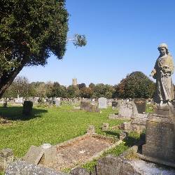 Image of a headstone carved into a statue of an angel